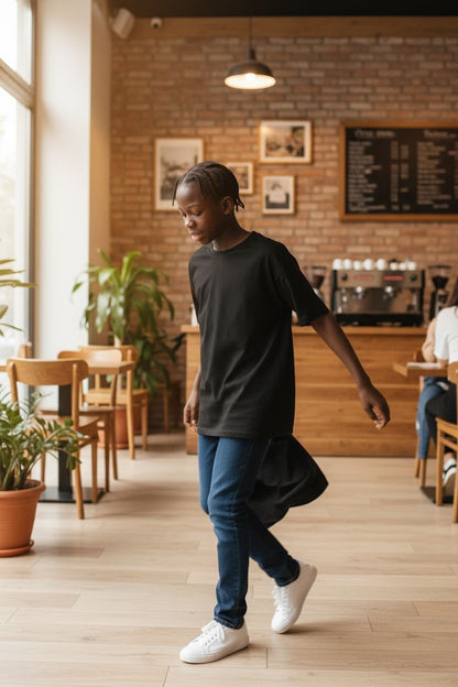 Person walking through a modern cafe with wooden floors and brick walls.